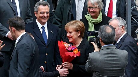 Marco Impagliazzo (links) mit Kanzlerin Merkel / © EPA/ALESSANDRO DI MEO (dpa)
