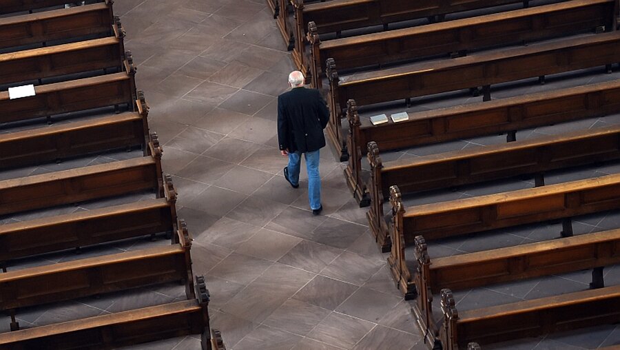Kirchen verlieren Mitglieder / © Arne Dedert (dpa)