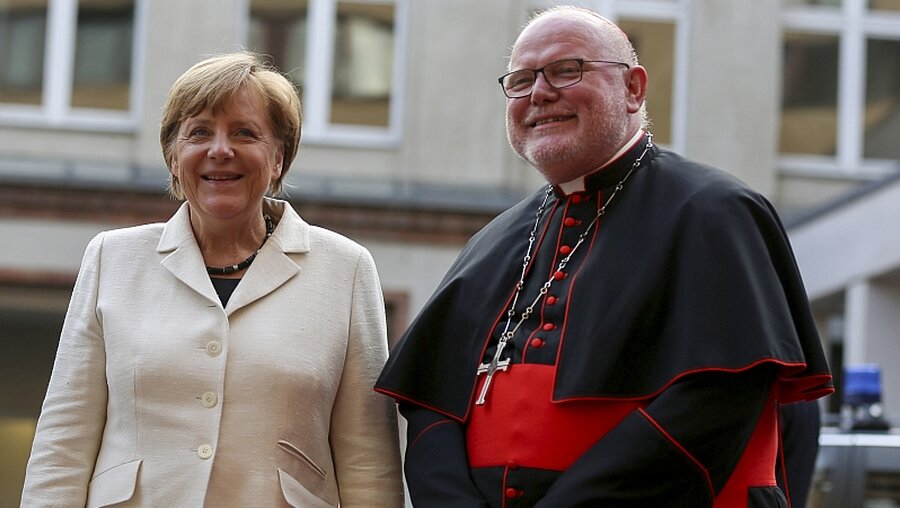 Treffen sich nicht auf dem Katholikentag: Kanzlerin Merkel und Kardinal Marx (KNA)