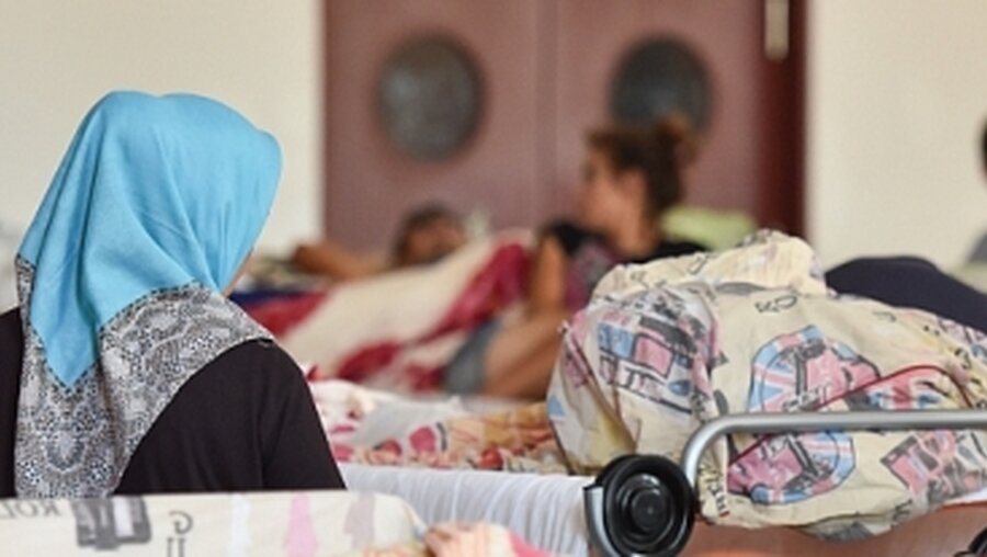 Muslimin in einer Flüchtlingsunterkunft in Heidelberg / © Uwe Anspach (dpa)