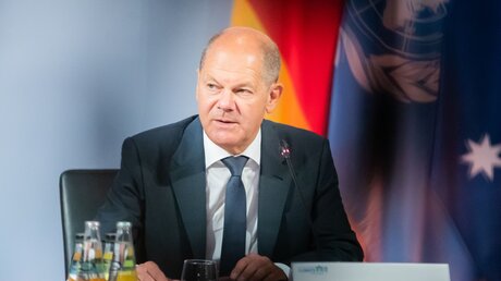 Bundeskanzler Olaf Scholz beim Petersberger Klimadialog  / © Christoph Soeder (dpa)