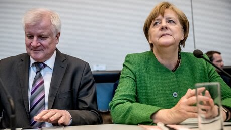 Horst Seehofer und Angela Merkel / © Michael Kappeler (dpa)