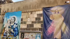 Jesus- und Heiligen-Bilder an der armenisch-katholischen Kirche in Bab Tuma, Damaskus. / © Rena Netjes (privat)
