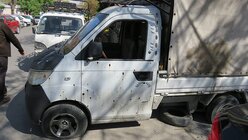 Reste des Bürgerkriegs: Ein zerschossenes Auto in den Wohnvierteln von Damaskus (DBK)